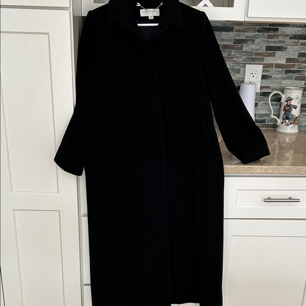 Black cashmere/wool coat, lined with flap to cover buttons. Winter clearance!
